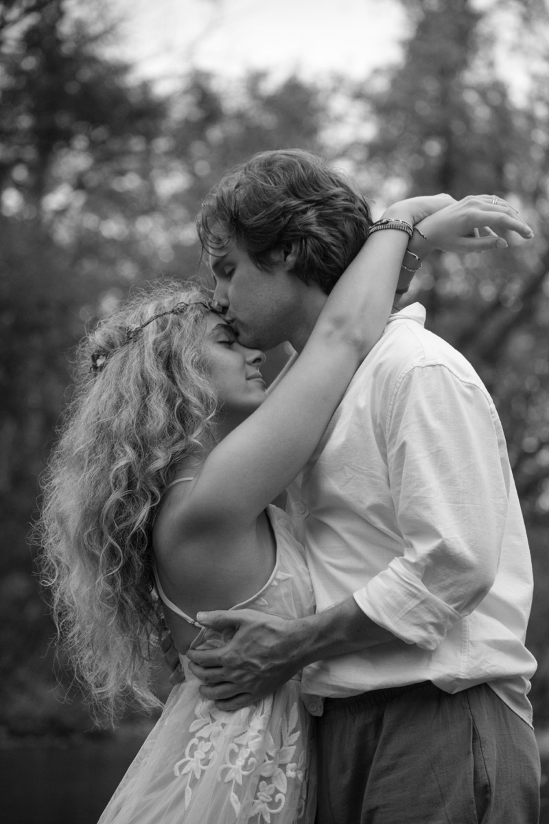 A couple embracing in a black and white portrait